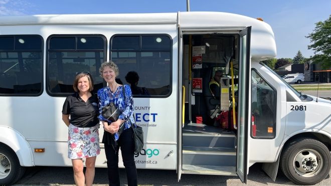 Warden Cathy Burghardt Jesson and Deputy Warden Aina DeViet in front of County Connect bus