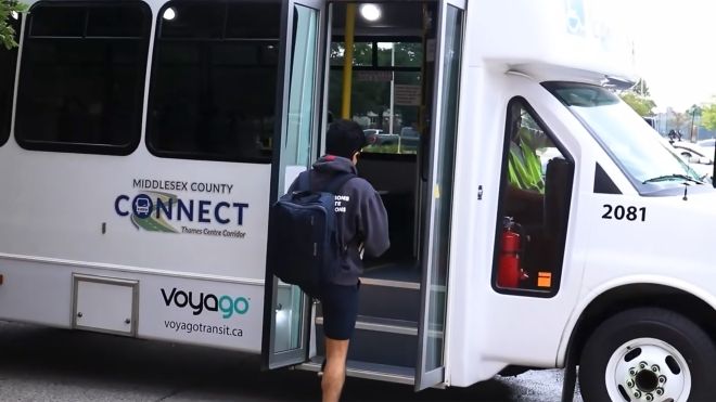 Student going in a County Connect bus 