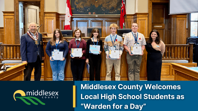 Image of five students with certificates standing between Warden Ropp and the County Clerk