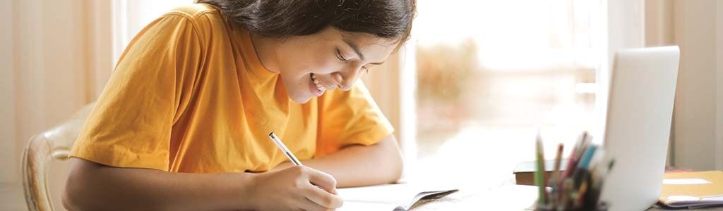 Woman writing on paper