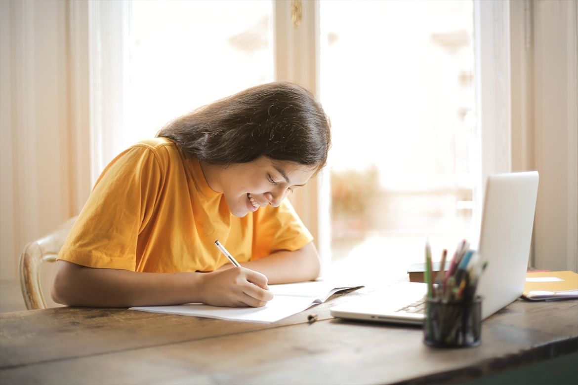 Woman writing on a notebook