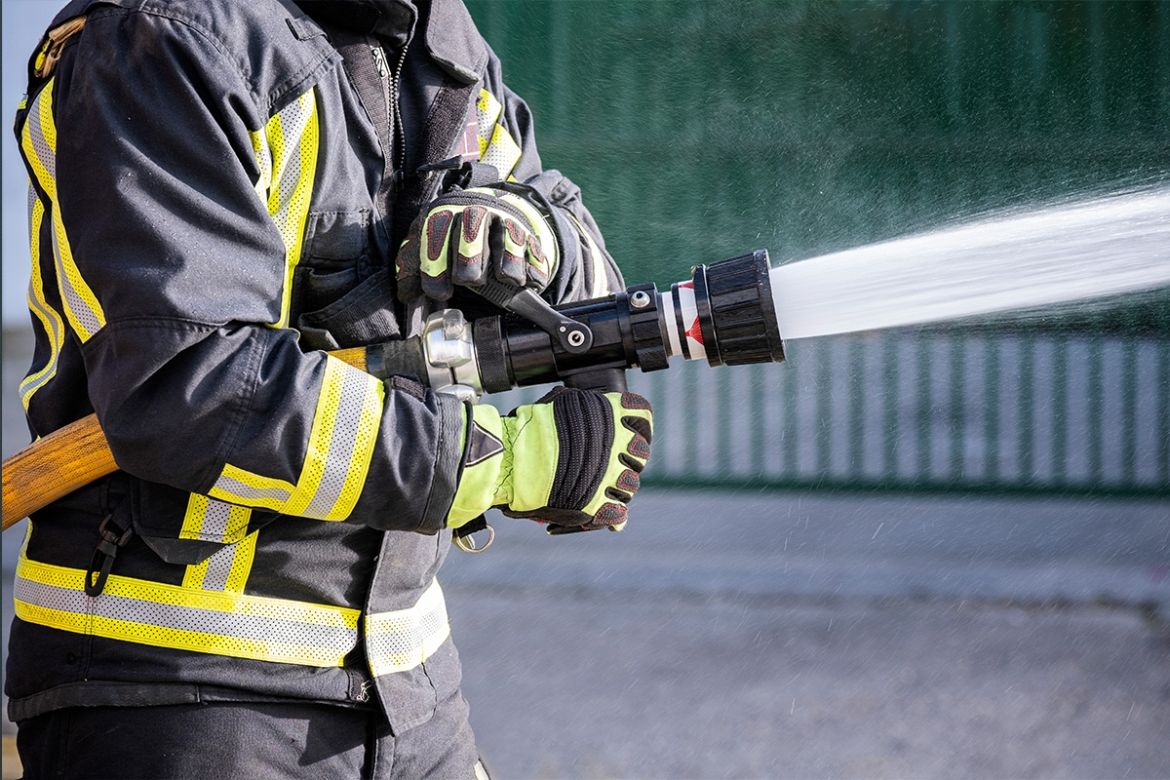 fire fighter holding a hose