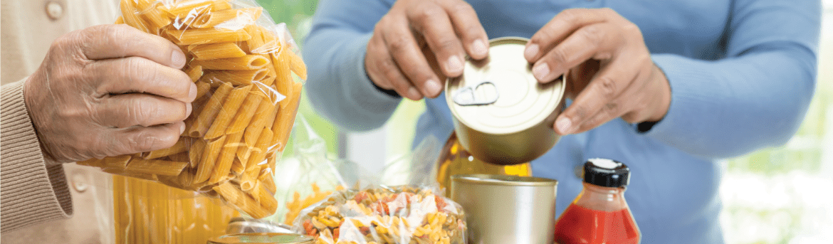 Image of two people handling non-perishable food donations