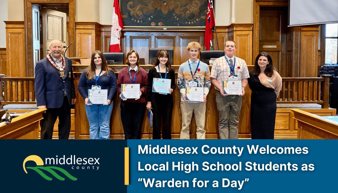 Image of five students with certificates standing between Warden Ropp and the County Clerk