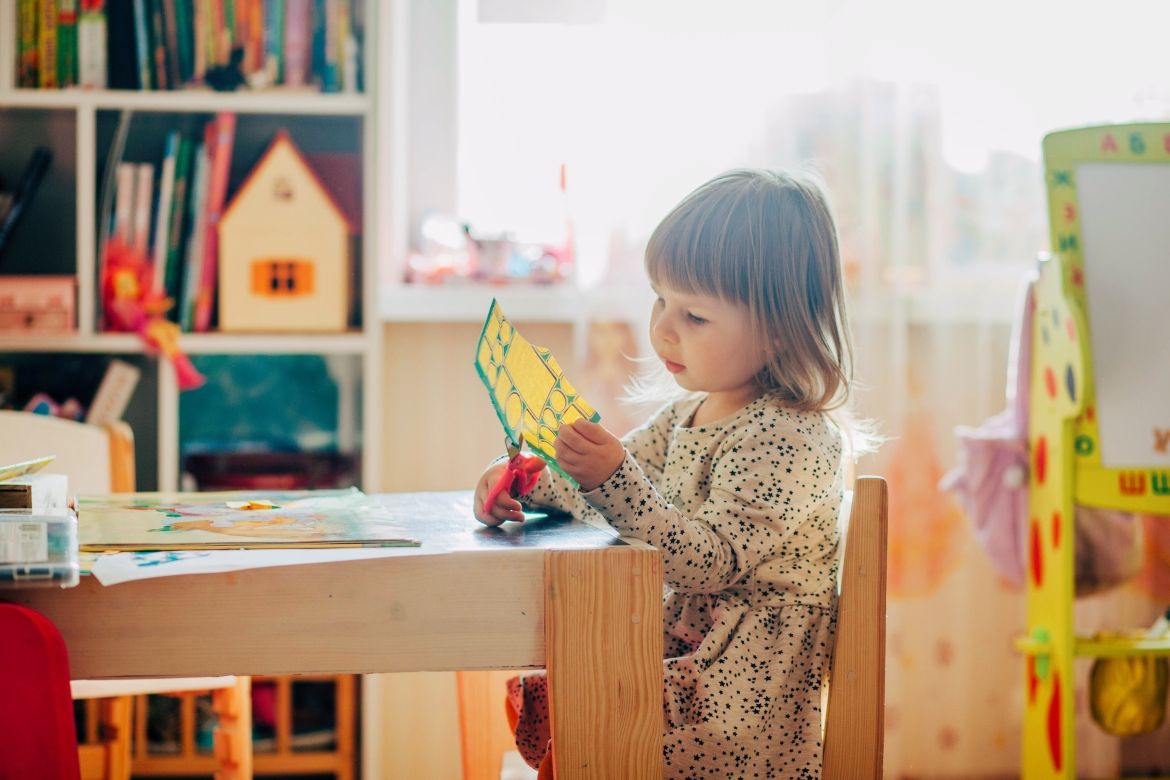 Child cutting paper