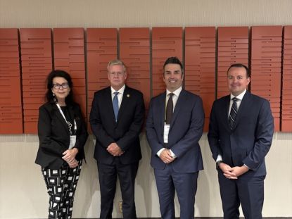Middlesex County representatives pose for a photo with provincial representatives at AMO 2026.
