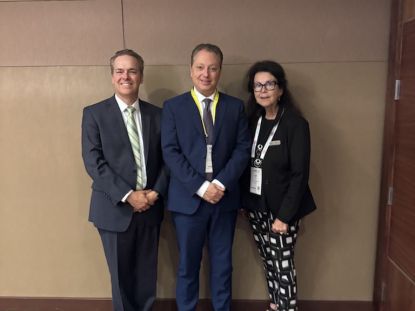 Middlesex County representatives pose for a photo with provincial representatives at AMO 2026.