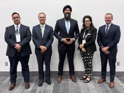 Middlesex County representatives pose for a photo with provincial representatives at AMO 2026.