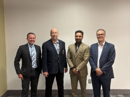 Image of four men in suits