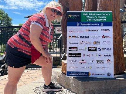 Warden with sponsorship signs