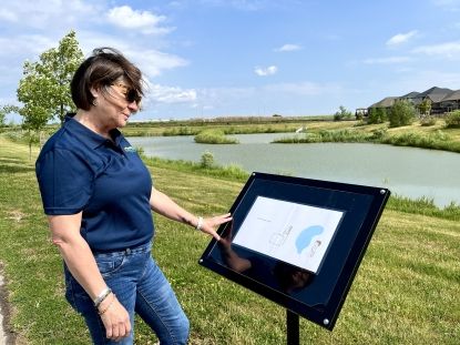 Warden Cathy Burghardt-Jesson reading Tales and Trails