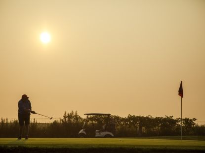 Person golfing 