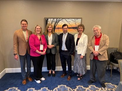 Image of six individuals at AMO Conference
